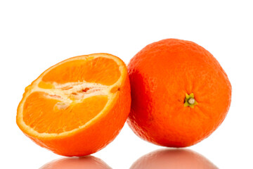 One half and one whole sweet organic tangerine, macro, isolated on white background.