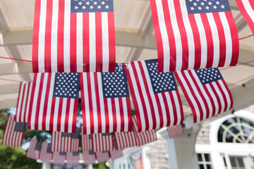 Fototapeta premium strings of American flags hanging as fourth of July party decor