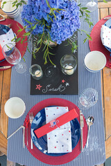 Overhead view of Fourth of July party table settings