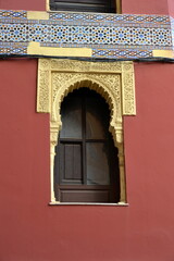Window of the facade near of the Great Mosque Mezquita, Catedral de Cordoba.