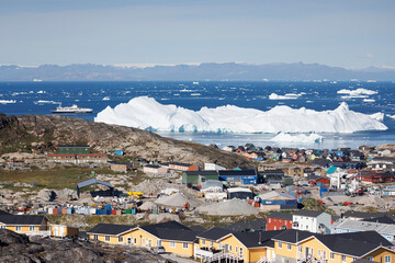 artic town with icebergs in background © Cavan