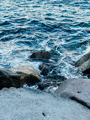 waves of the sea crashing against the rocks