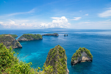Fototapeta premium Aerial view of the small island of Nusa Batumategan and Nusa Batupadasan Island from the Atuh Rija Lima shrine on Nusa Penida Island near Bali, Indonesia.