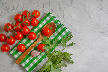 Cherry tomato, garlic, parsley on old background