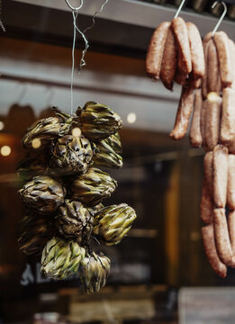Sausages hanging from a hook in a typical South American restaurant