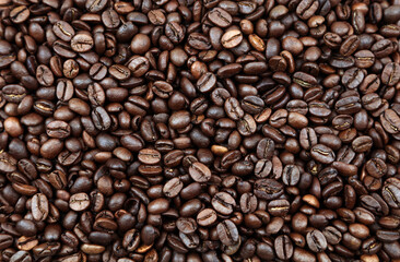 Close-up of roasted brown coffee beans background

