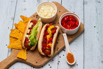 Homemade hot dogs with chilli pepper and other toppings