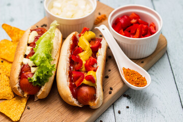 Homemade hot dogs with chilli pepper and other toppings
