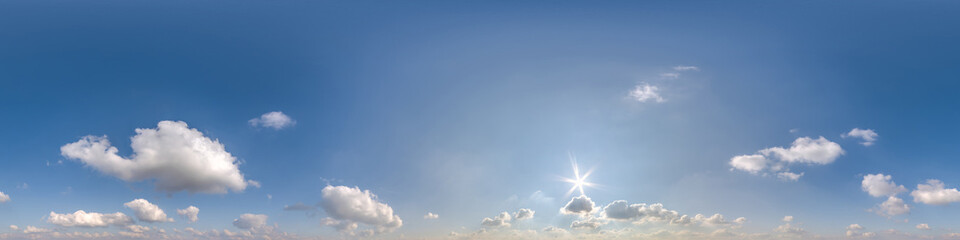 blue sky with cumulus clouds as seamless hdri 360 panorama with zenith in spherical equirectangular...