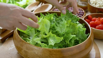  Mix Green Salad by Hand chef , Millet,Crab Stick In glass bowl. Breakfast fresh salad and clean vegetable can eat raw. Salad mix leaves green vegetable 