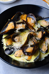 Freshly cooked mussles in wine and creamy sauce in a plate