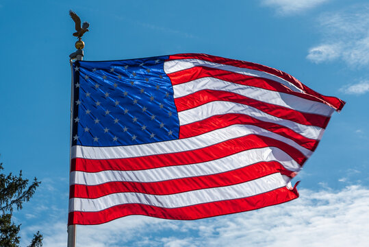 American Flag Waving in the Wind on a Summer Day