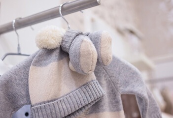 closeup of baby clothes on rack in a flea market.