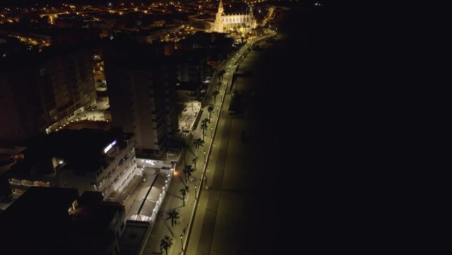 Sky view of Chipiona flying a drone, in the province of Cadiz at night (Andalucia, Spain). View of the Shrine of Our Lady of Regla