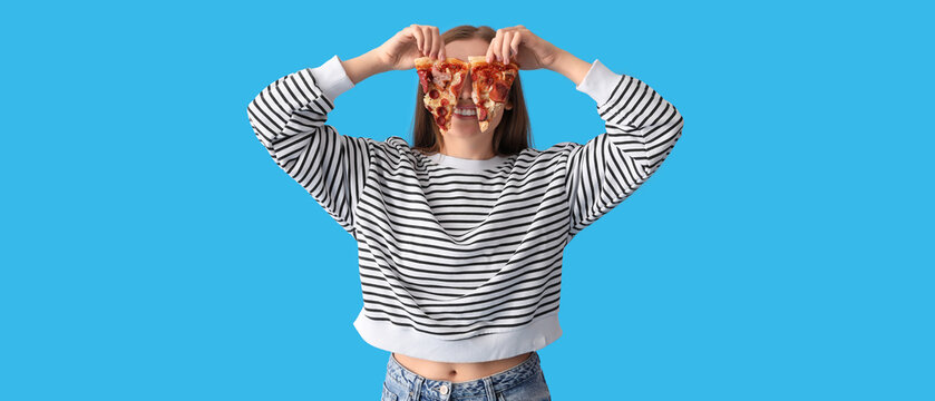 Funny Young Woman With Slices Of Fresh Pizza On Blue Background