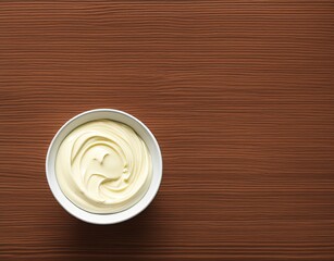 bowl of tasty mayonnaise on wooden background