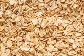 Raw oat flakes as background, closeup