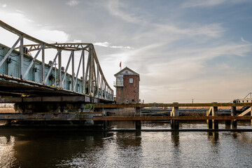 The large iron swing bridge over the River Yare in the village of Reedham in the Norfolk Broads...