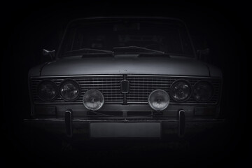 Front view of an old Russian car. Front view of radiator grill and lights