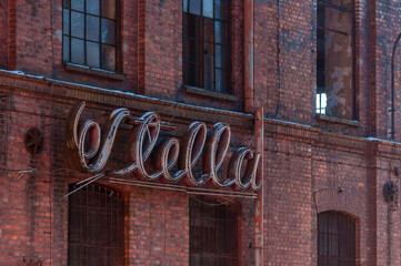 Obraz premium Old abandoned haunted red brick factory of stockings, pantyhose and socks in Central Europe, Poland