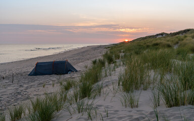 Tent on the Baltic  Sea beach on Sunrise  - 558233810