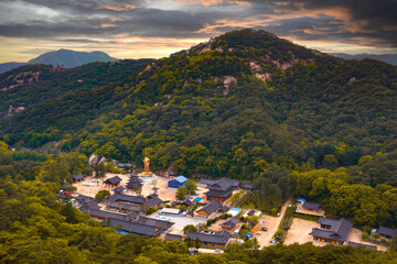 Aerial view of Beopjusa temple at sunset, courtyard, pagoda and giant Buddha statue, near Cheongju, North Chungcheong Province (Chungcheongbukdo) South Korea