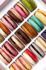 Macaroons in the box, top view, close-up. Design element. Popular french dessert
