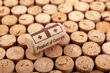 Wine cork with stamping PRODUCT OF GEORGIA. Used cork stoppers. Selective focus. Concept - Georgian...