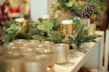 Golden glass candlesticks and tealight holders in the home decor store for retail sale