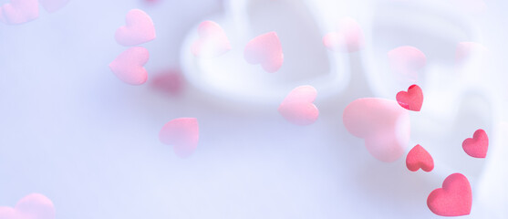 Red hearts on white background.  Large copy space area.  Two overexposed photos (no vector no illustration)