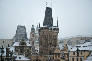 Fototapeta na wymiar View of the Charles Bridge and the Malostranska tower on a winter day. Prague Czechia