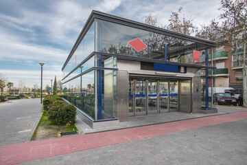 Metro station with escalators in a neighborhood on the outskirts of Madrid, Spain