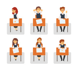 Obraz premium Cute school pupils sitting at desks at lesson. Front view of students in uniform writing in copy book, reading and listening cartoon vector illustration