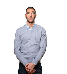 Serious young man looking against background