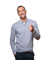 Amazed young man pointing at you with his finger