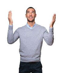 Astonished young man looking up