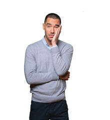 Tired young man doing a gesture of boredom