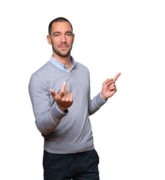 Happy young man doing a welcome gesture with his hand