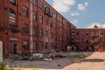Old abandoned haunted red brick factory of stockings, pantyhose and socks in Central Europe, Poland