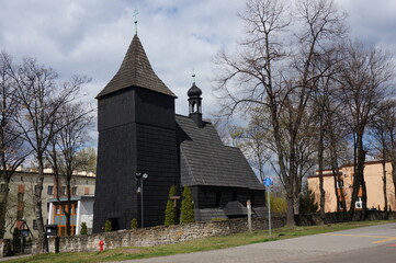 Fototapeta na wymiar Church of St. Lawrence (kosciol sw. Wawrzynca), wooden temple from 16th century. Chorzow, Poland.