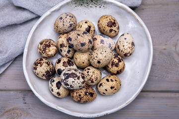 Fresh small spotted partridge or quail bird eggs