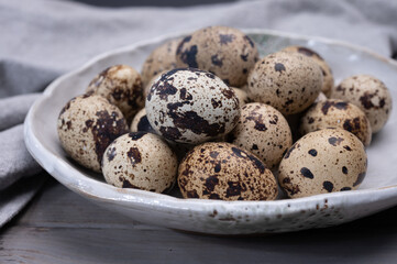 Fresh small spotted partridge or quail bird eggs