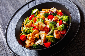 fried chicken tenders broccoli salad in bowl