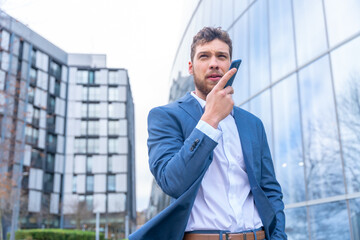 Professional corporate man businessman outside the office sending a voice memo