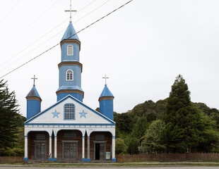Beautiful church (Iglesia de Tenaún) completely made of wood and painted in blue and white in Tenaún on Chiloé (Isla Grande de Chiloé) in Chile 