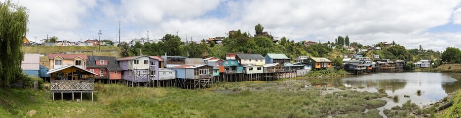 Fototapeta na wymiar Panorama of the Palafitos de Pedro Montt - colorful stilt houses on Chiloé (Isla Grande de Chiloé) in Chile 