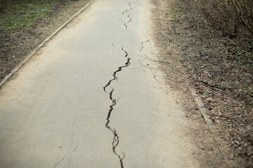 Crack in asphalt. Road with defect.