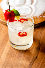 Margarita. Tequila cocktail consisting of Tequila, triple sec, lime juice served with salted rim of the glass. The drink is served shaken on the rocks or frozen.