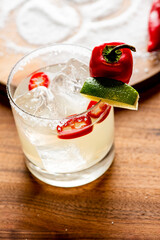 Margarita. Tequila cocktail consisting of Tequila, triple sec, lime juice served with salted rim of the glass. The drink is served shaken on the rocks or frozen.