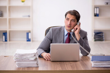 Young male employee working in the office